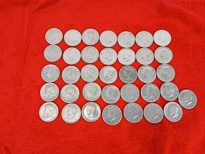 36 Kennedy half dollars. .