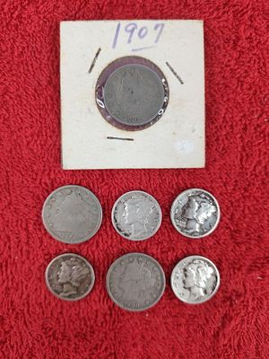 3 V nickels and 4 mercury dimes. 1907-1909 V nickels and 1935- 1943 mercury dimes