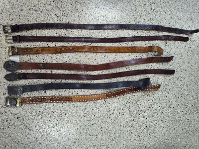 7 brown leather belts and belt buckles. belts range from 38 to 53 in long see photos for better 