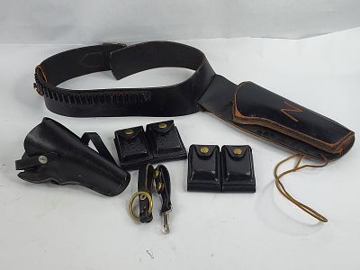 Black leather hunter cartridge belt , pistol holsters and double dump ammo holsters. Don Humes 