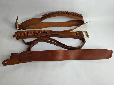 Brown leather cartridge belts and rifle slings. 32 to 40 in waist on belts