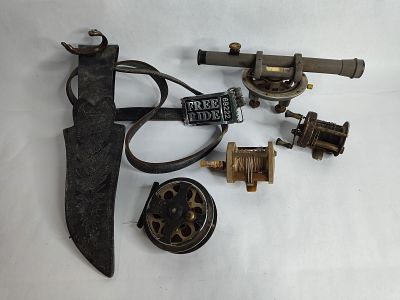 Old fishing reels ,leather belt with knife sheath and transit scope. .