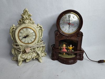 Holland mold Lanshire cherubs mantle clock and Master crafters lighted children swinging clock. c 