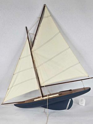 Wooden handcrafted sailboat model. main center pole has been repaired