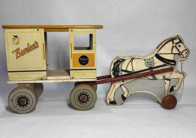 Rich Toys Borden's milk wagon. All wooden except body of wagon, shows minor fading and areas of 