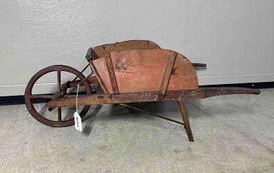 Early Salmon Painted Childs Wheel Barrow. Great construction with peg sides, and cast iron 