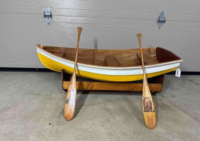 Handmade model boat. Nice little handmade boat that sets on wooden base. The outboard motor Lot 
