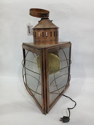 Triangular Copper Nautical Lantern. Electric, in working condition. One break to glass panel. 