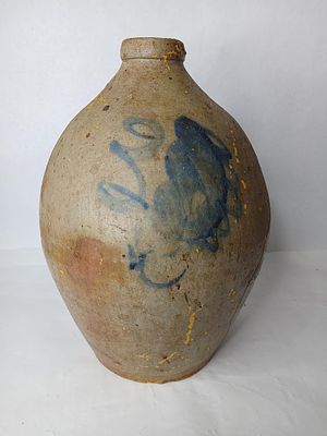 3 Gallon Stoneware Ovoid Jug. Large tornado style pattern to front, with a heavy crack down side 