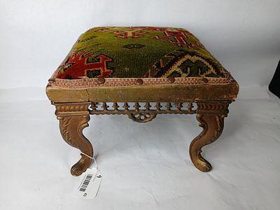 Cast Iron Covered Foot Stool. Turkish covering with embossed cast legs and a wooden frame. 12x12x9.5