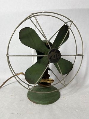 Little Green Zip Metal Desk Fan. Only 10 inches tall. Cord does show some taping. Works but fan 
