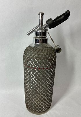 Sparkle Mesh Covered Seltzer Bottle. Very good condition. No chips or cracks to glass bottle