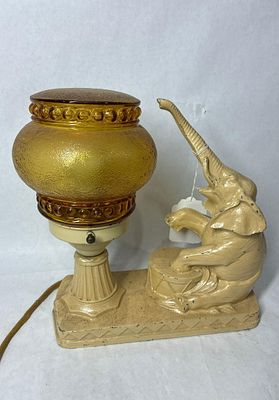 1930s Elephant & Circus Drum Art Deco Lamp. Speltzer with amber glass shade. Minor chipping to 