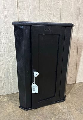 Black Painted Hanging Corner Cabinet. Square Nailed construction with enamel knob. 24x15.5x10.5