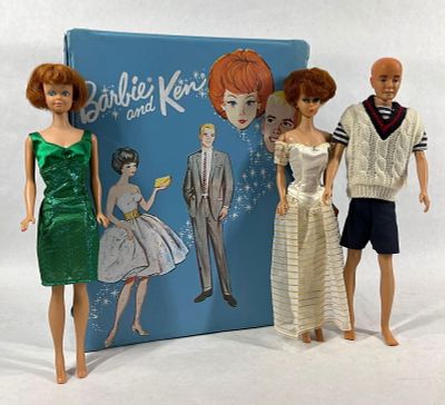 1960s Barbie, Ken, and Midge. Each doll is clothed and in good condition. Vintage carrying case 