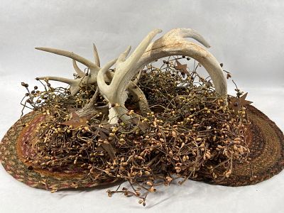 Deer Antler Primitive Centerpiece. WIth a berry and star garland and horn display.