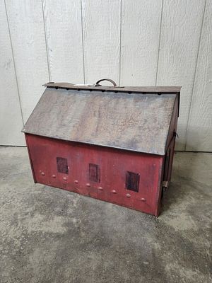 Darling Tin Barn Birdhouse. Sliding doors open to allow birds in or out. With a wooden bottom 