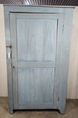 Primitive painted single door cabinet. With 3 fixed interior shelves and washed blue paint. 37in 