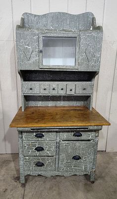 Early 1900s 2pc Baker's Cupboard. With crackled and is missing pull out on bottom piece. Unusual 