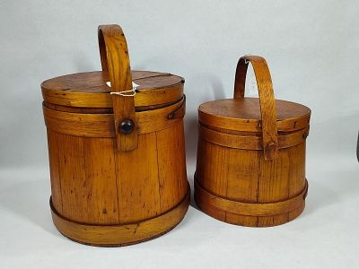 2-Primitive Firkin buckets. Larger one is 9.5in diameter 10in tall, smaller is 7.5in tall.