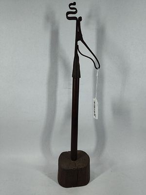 Hand forged wrought-iron Rushlight on wood. 23in tall.