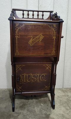 Floor Model Tournaphone Roller Organette. Featuring a freestanding walnut cabinet, hand crank 