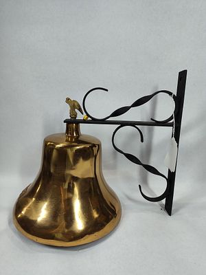 Polished brass U.S. Navy bell on bracket. Heavy brass bell attached to wrought iron bracket. 