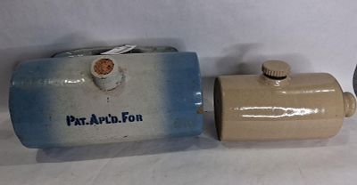 2- Stoneware Foot/Bed Warmers. Blue and white is made by Logan Pottery Co Logan, OH. Shows 2 