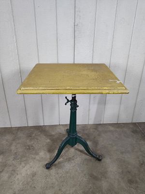 Early Tilt-Top Drafting Table. With early iron base. 33in tall.