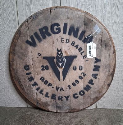 Whiskey barrel wall hanger. Barrel top with a hanger on back. 20in diameter.