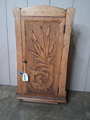 Early French carved hanging cabinet. Sturdy built 4 post cabinet with carved door and fixed 