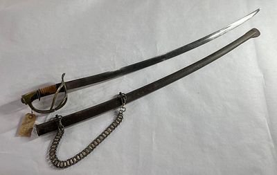 Civil War Cavalry Sabre. Curved blade with brass guard. Handle is leather wrapped but shows some 