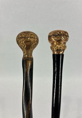 2- Victorian Gold Filled Canes/Walking Sticks. With ornate gold filled tops and one is etched 