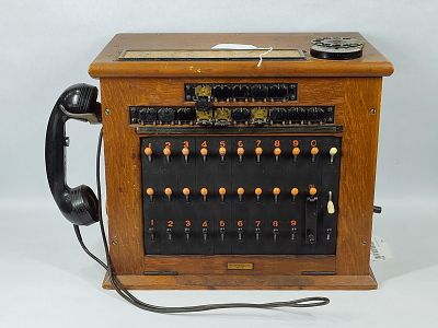 Western Electric Telegraph Oak Switch cabinet. Oak cabinet with Switch board on one side, dial 