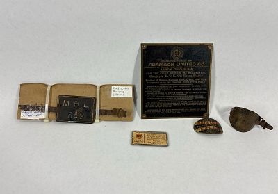 Old brass tags & Massillon Bicycle License. Includes 2 bicycle badges, an Adamson United Co. 
