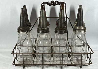 8- Glass 1qt oil bottles with carrier. All are identical.