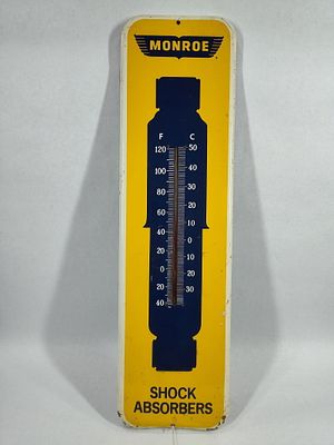 Monroe Shock Absorbers metal thermometer. Shows paint wear along bottom Edge and paint remnants 