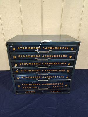 Stromberg Carburetors 7drw parts cabinet. Surface appears to be clearcoated. 19in wide 12in deep 