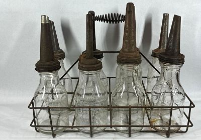 8- Various glass 1qt oil bottles with carrier. Includes 4 Jay B. Rhodes, one of those are 