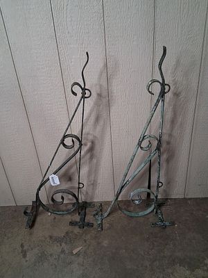 2- Wrought-iron sign brackets. Matching brackets. 17in x 34.5in long.
