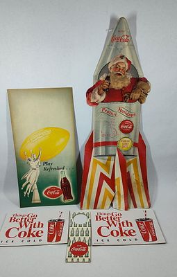 Lot of 5 Coca-Cola items. Includes a Rare 1957 Santa Claus Spaceship cardboard easelback store 