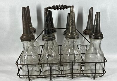 8- Various 1qt glass oil bottles with carrier. .