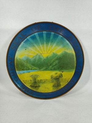 The Great Seal Of The State Of Ohio sign. 1-sided painted metal sign with some fading. 19in diameter.