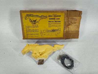 Illuminated 1965-66 Ford Mustang Grille Ornament. New old stock in original box. 3in x 7.5in long.