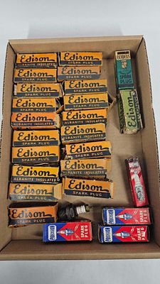 26- Various NOS Spark Plugs in boxes. Includes 19 orange Edison, 1 green Edison, 1 Bowers, 3 