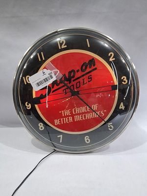 2015 Snap-On Tools lighted clock. With a heavily cracked glass dial, runs and lights as it should.