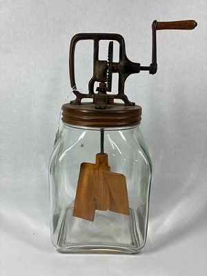 4 Qt Hand Crank Butter Churn. Glass butter churn with wooden paddles. All gears move smoothly. 