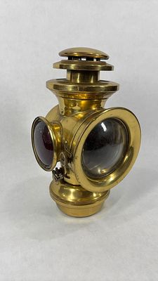 Knickerbocker Brass Goods Co. Brass Oil Tail Lamp. Original red globe