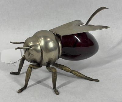 Mappin & Webb Honey Pot. Silver plated wings, legs, and body with a ruby red glass reservoir. 