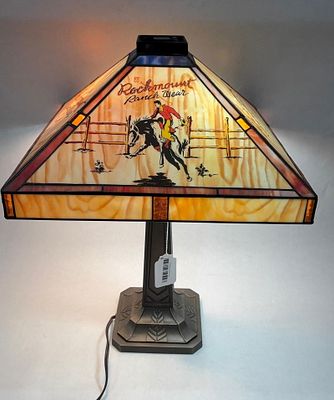 Rockmount Ranchwear Hand Painted Western Stained Glass Lamp. Showing a cowboy to two panes and 
